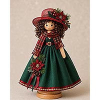 Handmade Christmas-themed wooden doll pin doll featuring a green holiday dress, red hat and scarf, poinsettia accents, curly brown hair, and a wooden display stand.