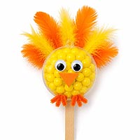 Baby chick fillable ornament half craft project made with yellow candies and feathers for Easter and spring decorations.