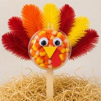 Thanksgiving turkey fillable ornament half craft idea using candy, feathers, and foam sheets for holiday decorations and children's crafts.