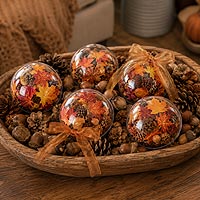 Fall fillable ornament decorations featuring autumn leaves and raffia ribbon for seasonal home décor and Thanksgiving decorating.