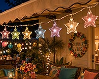 Colorful fillable star ornament craft ideas displayed as a lighted hanging star garland for patio, porch, party and festive outdoor decorations.