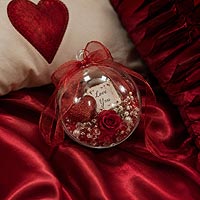 Valentine's Day fillable ornament craft idea featuring conversation hearts and pink decorations for romantic gifts and holiday home décor.