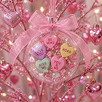 Decorative Valentine's fillable ornament idea with flowers and romantic embellishments displayed on an ornament stand for holiday décor.